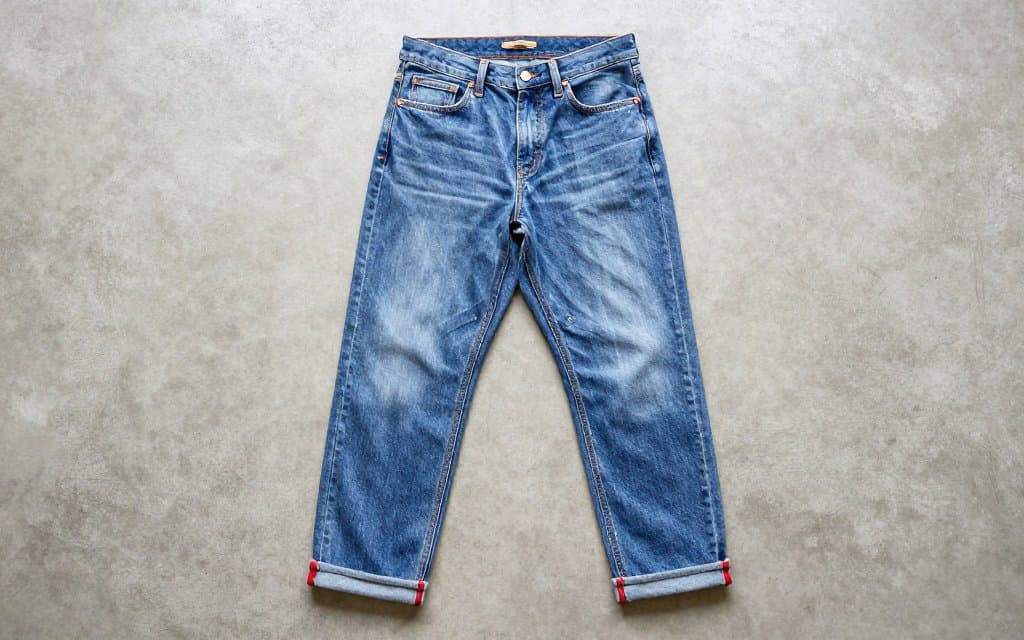 Top-down vintage selvedge denim Levis jeans with rolled cuffs showing redline seams