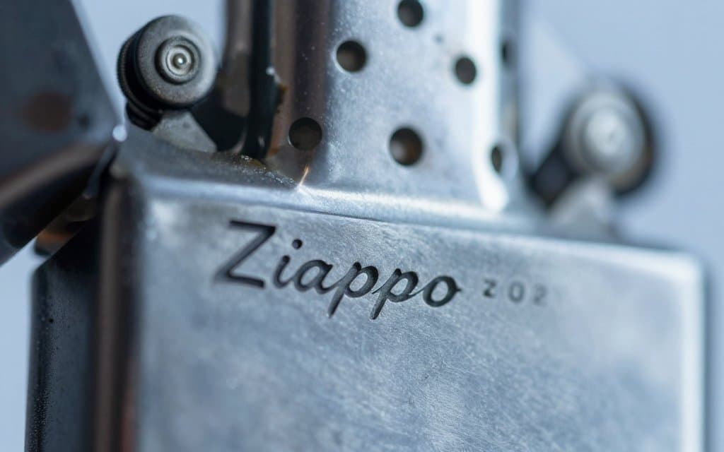 Macro of a Zippo date codes stamp with dots on the metal base
