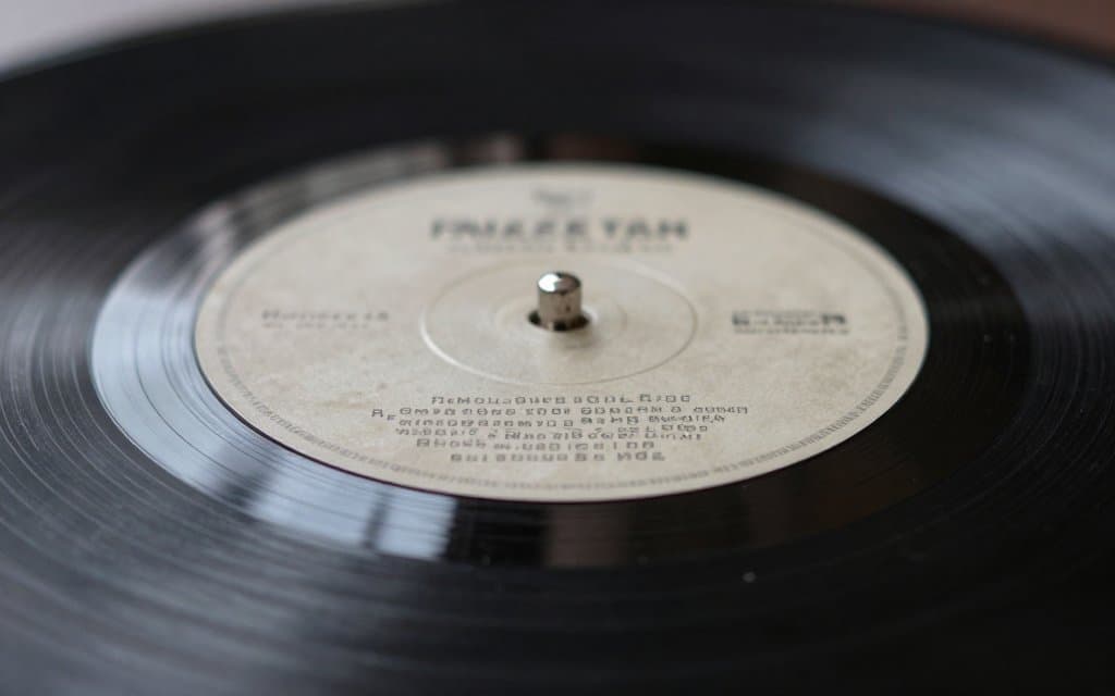 Macro view of dead wax matrix codes used to spot a first pressing vinyl record.