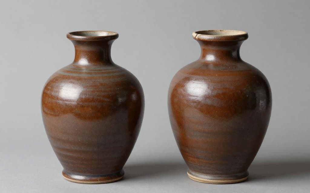 Comparison of two vintage pottery vases showing how condition changes value