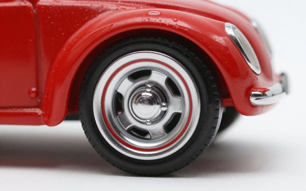Macro of a redline Hot Wheels wheel showing the painted red stripe that marks valuable cars