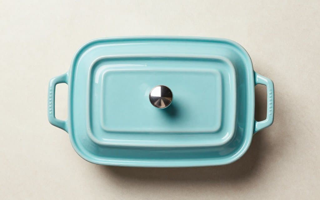 Top-down view of a rare vintage Pyrex casserole with an atomic pattern
