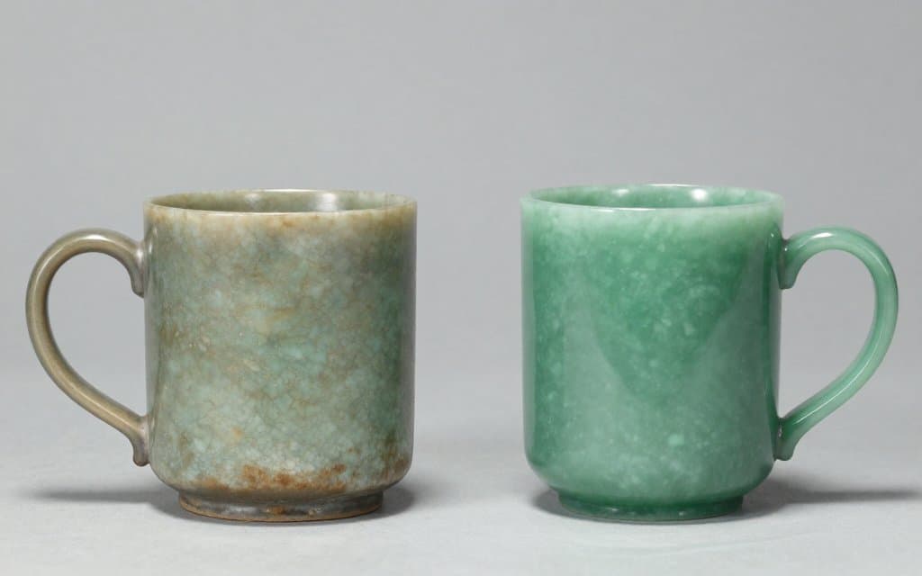 Two jadeite mugs side by side comparing a vintage piece and a modern reproduction