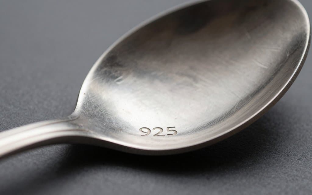 Macro of a sterling silverware hallmark stamped 925 on a spoon handle
