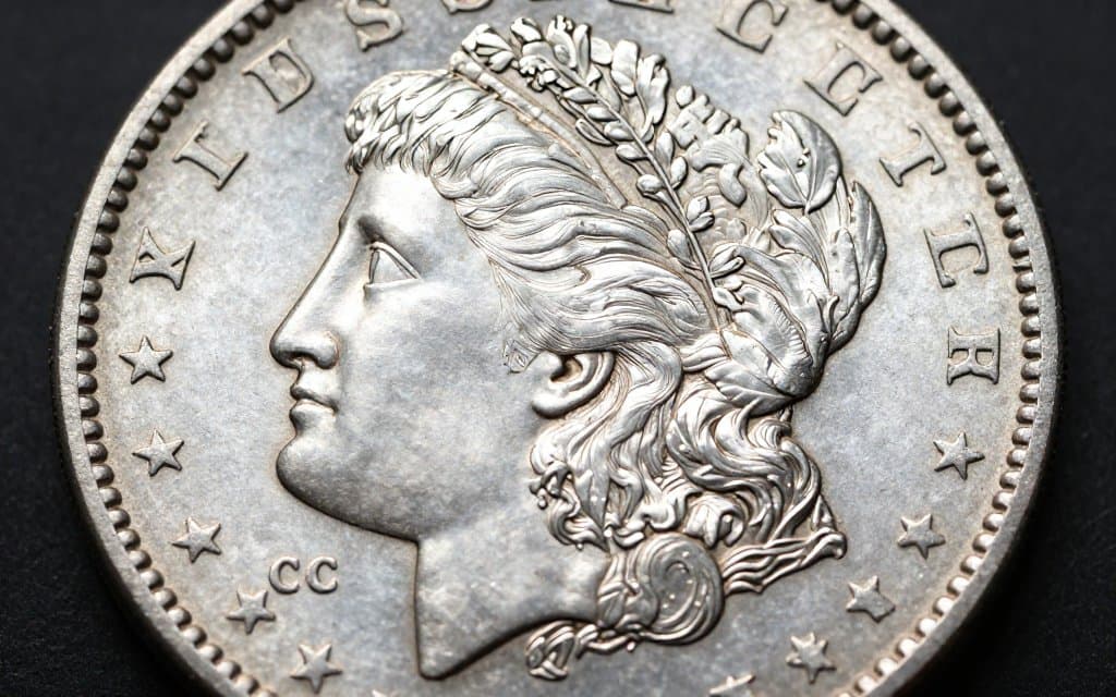 Macro view of a Morgan dollar reverse showing the CC mint mark that drives its resale value