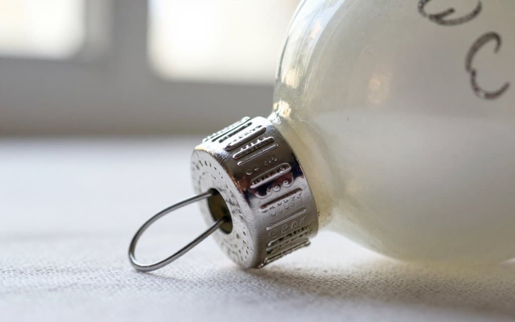 Macro of a metal cap on a vintage glass Christmas ornament used for dating