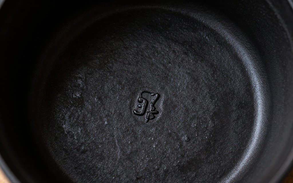 Macro view of the cast size number on the base of a vintage Le Creuset pot